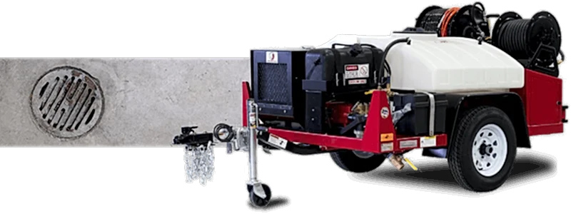 A hydro jetter next to a floor drain.