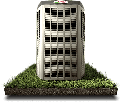 A heat pump on a grassy lawn.